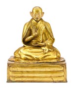 A GILT-BRONZE FIGURE OF A LAMA, POSSIBLY THE FIRST PANCHEN LAMA, TIBET, 18TH CENTURY | 十八世紀 藏傳鎏金銅喇嘛坐像，或為班禪喇嘛一世