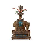 A large gilt-bronze and cloisonné enamel caparisoned elephant and stand, Qing dynasty, 19th century |  清十九世紀 鎏金銅掐絲琺瑯嵌寶太平有象