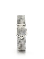 EBEL | A LADY'S WHITE GOLD CONCEALED BRACELET WATCH CIRCA 1980