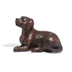 An English provincial carved and painted wooden model of a dog, late 19th/early 20th century