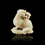A celadon and russet jade 'mythical beast and lingzhi' group, Qing dynasty, 18th century 清十八世紀 青白玉靈芝瑞獸