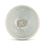 A moulded Yaozhou moon-white glazed 'fish' bowl, Northern Song - Jin dynasty 北宋至金 耀州月白釉印魚紋斂口盌