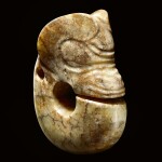 A RARE AND LARGE CALCIFIED YELLOW JADE ZHULONG ('PIG DRAGON') NEOLITHIC PERIOD, HONGSHAN CULTURE | 新石器時代紅山文化 黃玉豬龍
