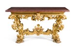  AN ITALIAN CARVED GILTWOOD CONSOLE TABLE, ROMAN, 18TH CENTURY AND LATER