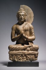 A GREY SCHIST FIGURE OF THE SEATED BUDDHA,  ANCIENT REGION OF GANDHARA, 3RD/4TH CENTURY