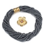 Hematite necklace, attributed to Poiray and a gold and diamond brooch, Van Cleef & Arpels