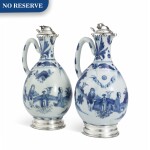 A PAIR OF CHINESE BLUE AND WHITE PORCELAIN EWERS WITH SILVER MOUNTS, THE PORCELAIN MID 17TH CENTURY; THE SILVER DUTCH, 19TH CENTURY