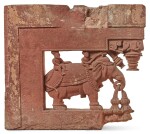 A MUGHAL CARVED RED SANDSTONE ARCHITECTURAL BRACKET, NORTH INDIA, CIRCA 17TH CENTURY
