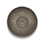 A silver repoussé 'dragon' bowl, Central Asia or Tibet, circa 6th/7th century | 中亞或西藏 約六/七世紀 瑞獸紋銀盌