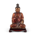 A gilt-lacquered wood figure of Buddha, Ming dynasty | 明 漆金木雕佛坐像