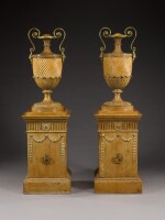 A pair of George III gilt-bronze mounted carved mahogany, lime and pine urns and pedestals by John Linnell, 1767, the urns designed by Robert Adam