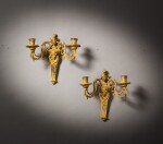 A pair of gilt-bronze two-light wall lights, possibly Austria, late 18th century | Paire d'appliques à deux lumières en bronze doré, travail étranger, probablement Autriche, fin du XVIIIe siècle