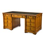 A Victorian carved oak partner's desk, circa 1855, designed by A.W.N. Pugin and made by Gillows