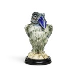 A Martin Brothers stoneware `Wally Bird' tobacco jar and cover by Robert Wallace Martin, 1902