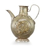 A rare parcel-gilt silver repoussé 'makara' ewer Liao dynasty | 遼 銀鎏金魚龍紋把壺