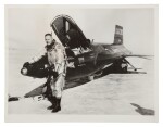 [X-15] NEIL ARMSTRONG WITH THE FIRST X-15 ROCKET PLANE. VINTAGE SILVER GELATIN PRINT, 1960.