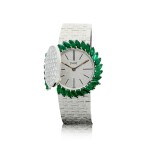 REFERENCE 9177A6 A LADY'S WHITE GOLD BRACELET WATCH WITH EMERALD BEZEL AND DIAMOND-SET COVER THAT REVEALS A CONCEALED DIAL, CIRCA 1970