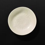 An incised Dingyao ‘peony’ dish, Northern Song dynasty 北宋 定窰白釉刻花牡丹紋盤