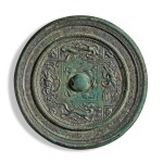 A rare inscribed 'four cardinal directions' silvered bronze mirror, Sui / Tang dynasty | 隋 / 唐 銅鎏銀瑞獸紋鏡