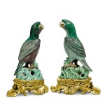 A pair of ormolu-mounted Chinese famille-verte biscuit figures of parrots the porcelain Kangxi, the mounts late 19th century, both stamped MB for Théodore Millet 