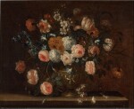 Still life of roses, carnations, tulips, honeysuckle and other flowers in an urn on a stone ledge