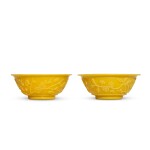 A pair of carved yellow glass 'floral' bowls, Qing dynasty | 清 黃料花卉紋盌一對