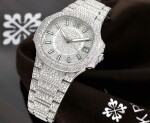 REFERENCE 7021/1G-001 NAUTILUS A LADY'S WHITE GOLD AND DIAMOND-SET AUTOMATIC BRACELET WATCH WITH DATE, CIRCA 2017