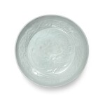 A molded 'Shufu' white-glazed 'lotus' dish, Yuan dynasty | 元 樞府白釉印花纏枝蓮紋盤