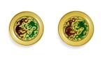 A pair of green and aubergine-enamelled yellow-ground 'dragon' dishes Marks and period of Kangxi | 清康熙 黃地紫綠彩葡萄雲龍紋盤一對 《大清康熙年製》款