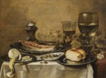 PIETER CLAESZ | Still life with a roemer, olives, a half-peeled lemon, bread rolls and fish on pewter plates, all on a table draped with a white cloth