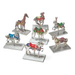 A GROUP OF SEVEN SILVER AND ENAMEL CAROUSEL FIGURES, DESIGNED BY GENE MOORE FOR TIFFANY & CO., NEW YORK, CIRCA 1990