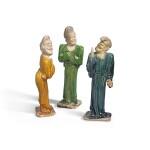 THREE POTTERY FIGURES OF FOREIGNERS, TANG DYNASTY | 唐 胡人陶俑一組三件