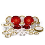 An extensive Limoges porcelain tea, coffee and dessert service, a set of water glasses, a moulded ruby glass fruit service and a large set of white and gilt tea bowls, 20th century, various makers