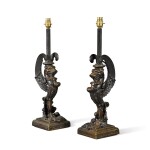 A pair of Regency style patinated bronze winged lion monopedia, late 19th century