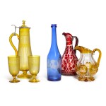A Bohemian cut, amber-stained and engraved ewer, a ruby stained example, a blue stained carafe and an amber-stained ewer and goblets set, late 19th century