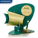 ROLEX | OYSTER PERPETUAL A GILT BRASS AND GREEN ENAMEL RETAILER'S WINDOW DISPLAY, CIRCA 1960