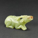 A YELLOWISH-CELADON JADE FIGURE OF A DEER SONG DYNASTY OR LATER | 宋或更晚 青白玉雕臥鹿