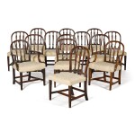 A set of fourteen George III carved mahogany dining chairs by Gillows, 1784