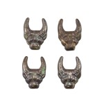 A group of four silvered bronze 'buffalo' fittings, Eastern Zhou dynasty 東周 銅鎏銀牛首形飾一組四件