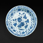 A very rare and finely painted blue and white 'melon' charger, Ming dynasty, Yongle period | 明永樂 青花纏枝瓜果紋折沿盤