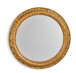 A Continental carved giltwood circular mirror, 19th century   