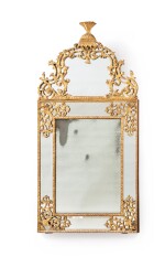 A carved and gilt wood mirror, French Regence, circa 1720 