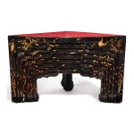 A SET OF SEVEN CHINESE BLACK, RED, AND GOLD LACQUER STACKING TABLES
