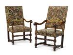 A pair of Louis XIV carved walnut fauteuils, second half 17th century