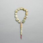 A string of celadon jade beads, Neolithic period, Hongshan culture | 新石器時代 紅山文化 玉珠管一串