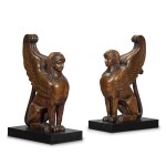 A pair of large Empire carved mahogany griffins, early 19th century