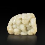 A white and russet jade 'mythical beast' group, Qing dynasty, 18th century |  清十八世紀 白玉雙瑞獸