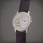 Octa Réserve de Marche | A platinum wristwatch with date, power reserve indication and brass movement, Circa 2003