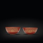 A pair of coral-ground gilt-decorated 'lotus' wine cups, Qing dynasty, 19th century | 清十九世紀 珊瑚紅地描金纏枝蓮福壽紋小盃一對 《大清乾隆年製》仿款