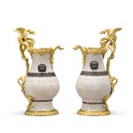 A pair of gilt-bronze mounted Chinese crackle-glaze celadon porcelain ewers, the porcelain Kangxi period (1662-1722), the mounts Régence/Louis XV, circa 1730-1740